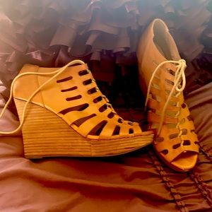 Restricted wedge lace up heel, size 10